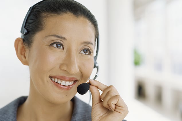 A woman conduction a phone interview