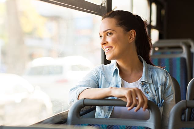 A young woman traveling on a bus