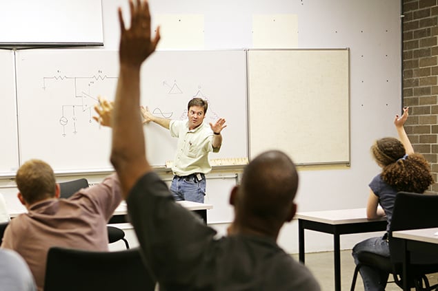 International Student raises hand in class